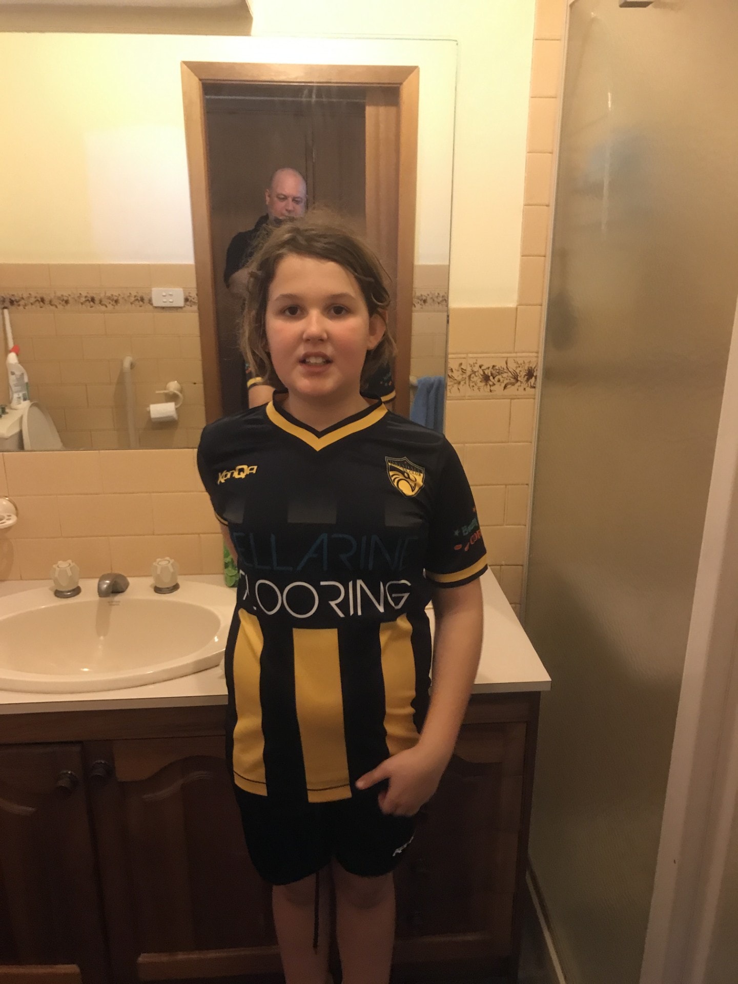 Child in Bellarine football uniform — proud and ready to play