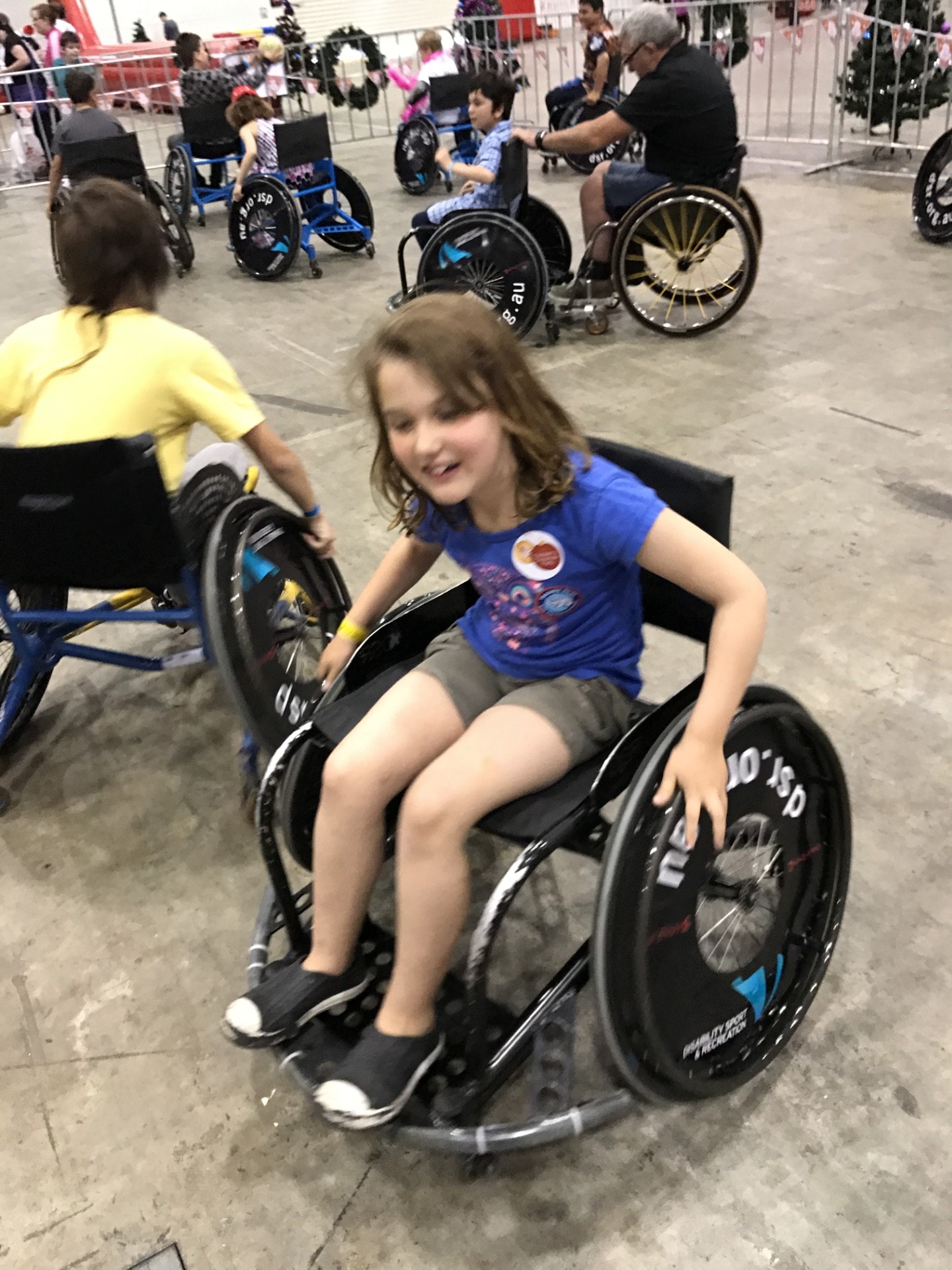 Children participating in wheelchair sports at an inclusive event